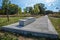 Pedestrian walkway with park bench made of concrete