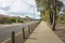 Pedestrian walkway in a quiet residential neighbourhood street with some suburban houses/homes in the distance.