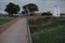 pedestrian wooden walkway with windmill deactivated at the end of the route.  city â€‹â€‹of Barreiro, SetÃºbal district