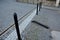 In the pedestrian zone, the entrance is regulated by black decorative steel posts. the post can be tilted to the ground for passer