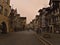 Pedestrian zone in historic town center on cloudy winter day. Orange colored sky due to rare weather phenomenon.