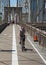 Pedestrians and bicyclists crossing Brooklyn Bridge