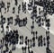 Pedestrians cast shadows walking along the Zeil in Frankfurt am Main