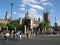 Pedestrians cross the Bridge Street on crosswalk   near the Westminster Palace  Houses of Parliament  in London, UK .