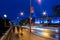 Pedestrians crossing Princes Bridge in Melbourne at night