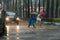 Pedestrians crossing street during Typhoon Megi