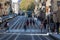 Pedestrians crossing the tram tracks in central Bordeaux