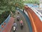 Pedestrians ride across the approach bridge.