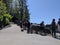 Pedestrians viewing the majestic Snoqualmie Falls from one of the viewpoints on a sunny day