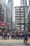 Pedestrians wait before crossing Nathan Road at Tsim Sha Tsui, Kowloon, Hong Kong