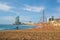 Pedestrians walk along Barceloneta Beach in Barcelona with color