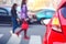 Pedestrians walk along a crosswalk in a lunch hour.