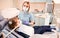 Pediatric dentist examining little girl teeth in dental office.