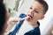 Pediatrician checks the throat of a boy.