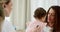 Pediatrician, child and mother for a healthcare consultation using stethoscope for examining health and breathing in a