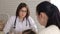 Pediatrician talking with a mother in the clinic.