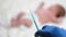 Pediatrician vaccinating newborn baby. Vaccine, Vaccination for infant child Soft focus Syringe in hands of a nurse and blurred