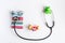 Pediatrics equipment with toys, stethoscope white background top view space for text