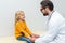 pediatrist holding hands of little girl