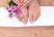 Pedicure on legs and beautiful manicure on hands closeup