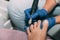Pedicure process in salon. Foot care treatment and nail. The process of professional pedicures. Master in blue gloves makes pedicu