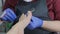 pedicure salon employee uses a nail file during a toe treatment. Close up, selective focus.