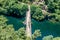 PedrogÃ£o Pequeno PORTUGAL - Aerial view of medieval Filipina bridge over the river ZÃªzere with bikers contemplating