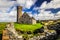 Peel Castle`s tower next to Saint Patrick`s Church constructed by vikings at Peel city in Isle of Man