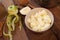 Peeled apple beside chopped pieces in bowl