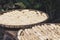 Peeled bananas drying in bamboo baskets exposed to the sun