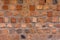 Peeled brick wall, clay brick and old texture