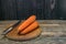 Peeled carrot with knife on a cutting board