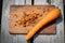 Peeled carrot on wooden stave. Preparation for cooking vegetables