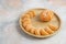 Peeled clementine mandarins over wooden plate on background