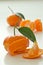 Peeled clementines with leaves