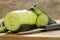 Peeled cucumber on a wooden board