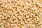 Peeled dried pine nuts background