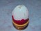 Peeled Easter egg topped with Adyghe salt. A natural and healthy product. Colorful Easter eggs - part of the passover meal.