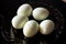 Peeled eggs on a black plate. Hard-boiled eggs. Cooking