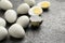 Peeled hard boiled quail eggs on grey table, closeup