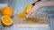 Peeled orange on wooden cutting board.