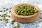 Peeled pumpkin seeds in wood bowl