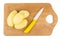 Peeled raw potatoes and ceramic knife on hardboard