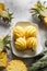 peeled small pineapple on a white plate