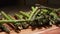 Peeled stems of green asparagus fall on the table