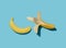 Peeled and unpeeled banana on light blue background