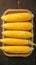 Peeled yellow corn on wooden table Fresh and appetizing display