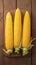 Peeled yellow corn on wooden table Fresh and appetizing display