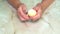 Peeling boiled chicken eggs with your hands for cooking.