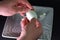 Peeling a boiled egg. A man is cleaning egg for breakfast